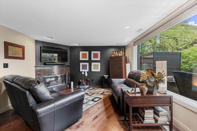 1162 W Farwell Ave, Chicago, IL 60626 - living area with a high end fireplace, wood finished floors, baseboards, and recessed lighting