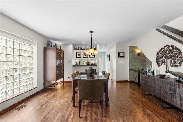 1162 W Farwell Ave, Chicago, IL 60626 - dining space with wood finished floors, a chandelier, baseboards, and recessed lighting