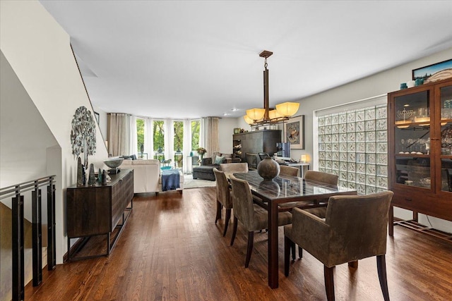 1162 W Farwell Ave, Chicago, IL 60626 - dining room featuring a chandelier and dark wood-style flooring