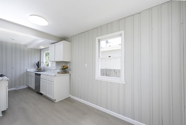 6008 240th Ave, Paddock Lake, WI 53168 - kitchen with dishwasher, light wood-style flooring, a sink, and white cabinetry