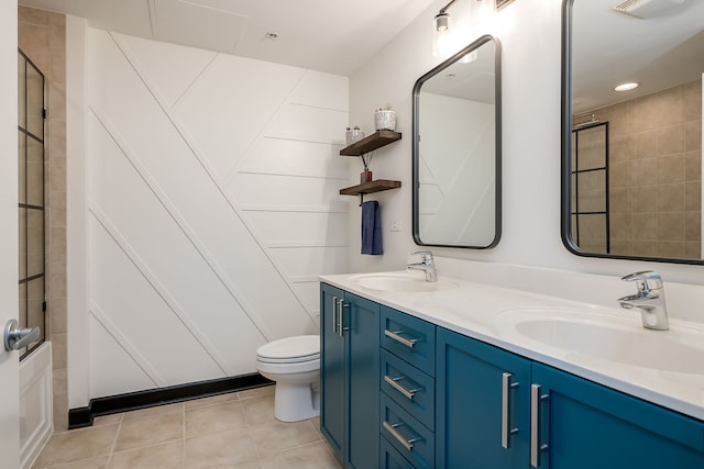 full bathroom featuring toilet, double vanity, tile patterned flooring, tiled shower, and recessed lighting