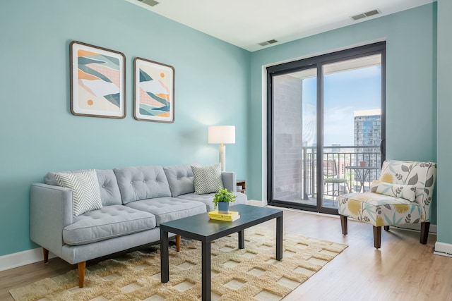living room featuring wood finished floors and baseboards