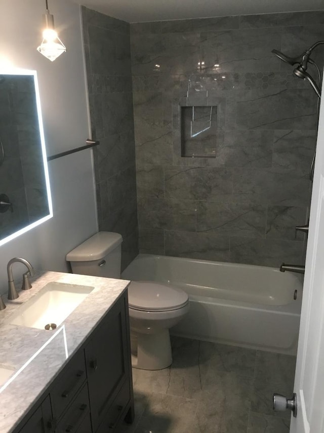 bathroom with toilet, shower / bath combination, and vanity