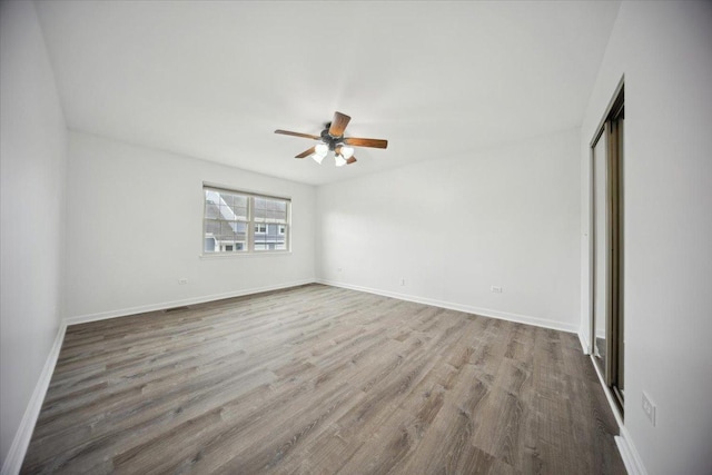 1242 N Knollwood Dr Unit 1242, Palatine, IL 60067 - empty room with a ceiling fan, wood finished floors, and baseboards