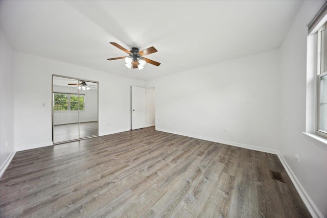 1242 N Knollwood Dr Unit 1242, Palatine, IL 60067 - unfurnished room featuring wood finished floors, ceiling fan, and baseboards