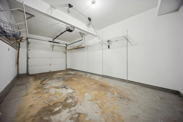 1242 N Knollwood Dr Unit 1242, Palatine, IL 60067 - garage with a garage door opener and baseboards