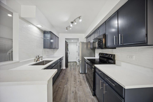 1242 N Knollwood Dr Unit 1242, Palatine, IL 60067 - kitchen with black appliances, a sink, backsplash, light wood-style floors, and light countertops