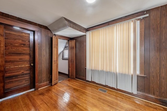 7629 S Green St, Chicago, IL 60620 - unfurnished room featuring wood-type flooring and wood walls