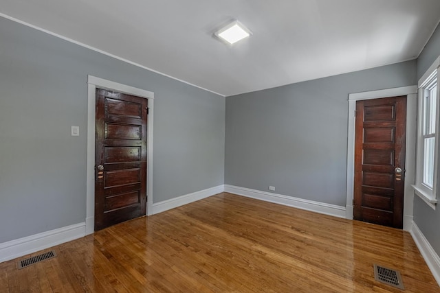 7629 S Green St, Chicago, IL 60620 - unfurnished room with baseboards and wood finished floors