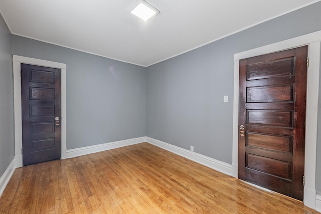 7629 S Green St, Chicago, IL 60620 - entrance foyer featuring light wood finished floors, baseboards, and ornamental molding