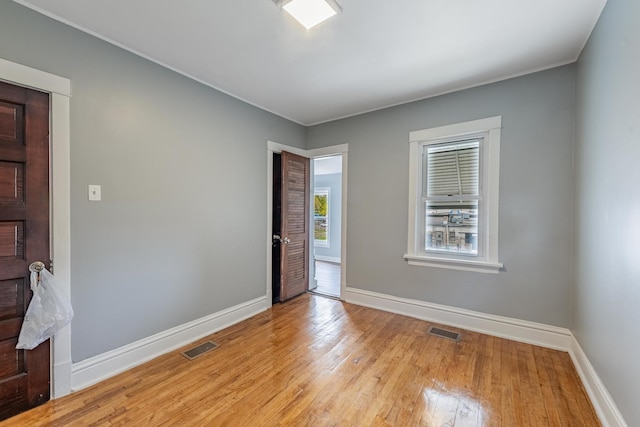 7629 S Green St, Chicago, IL 60620 - unfurnished room with baseboards and light wood-type flooring