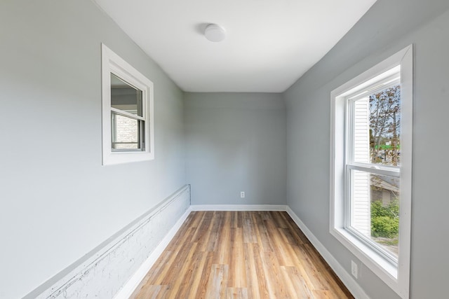 7629 S Green St, Chicago, IL 60620 - empty room with light wood-type flooring and baseboards