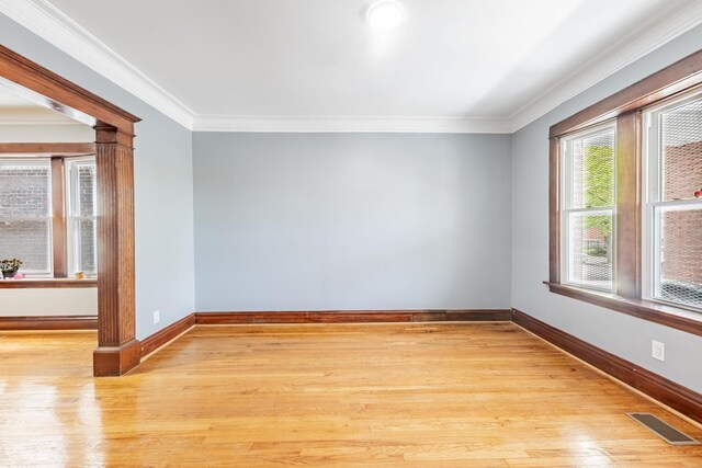 7629 S Green St, Chicago, IL 60620 - unfurnished room with ornamental molding, baseboards, and light wood-type flooring