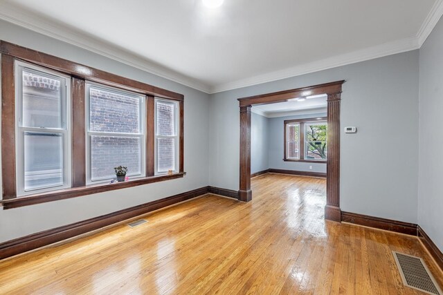 7629 S Green St, Chicago, IL 60620 - unfurnished room featuring light wood-style flooring, baseboards, and crown molding