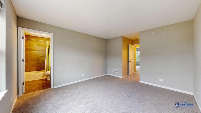 1255 Danforth Ct, Vernon Hills, IL 60061 - unfurnished bedroom featuring carpet flooring, baseboards, and connected bathroom