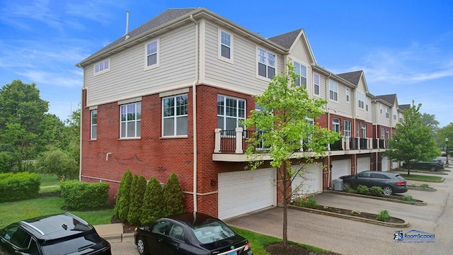 1255 Danforth Ct, Vernon Hills, IL 60061 - view of home's exterior featuring a garage, brick siding, and driveway