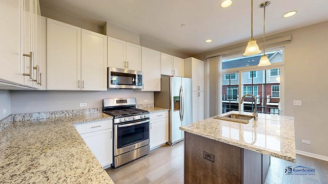 1255 Danforth Ct, Vernon Hills, IL 60061 - kitchen with appliances with stainless steel finishes, a sink, light wood finished floors, white cabinetry, and recessed lighting