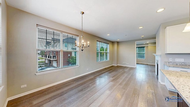 1255 Danforth Ct, Vernon Hills, IL 60061 - unfurnished dining area with a chandelier, light wood finished floors, baseboards, and recessed lighting