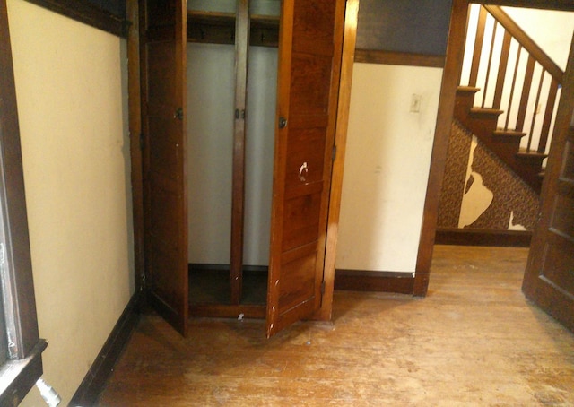201 E N St, Ridge Farm, IL 61870 - below grade area with wood finished floors, baseboards, and stairs