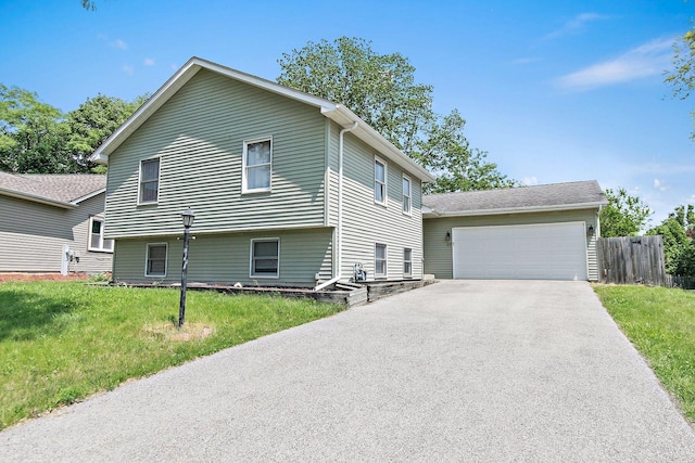 17 Autumn Ln, Streamwood, IL 60107 - view of front of house featuring a garage and driveway