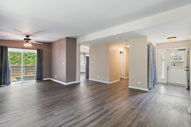 17 Autumn Ln, Streamwood, IL 60107 - unfurnished living room featuring dark wood-style floors and ceiling fan
