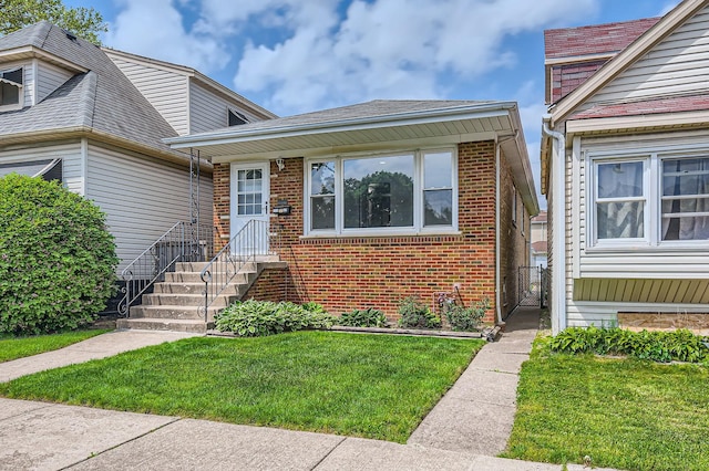 10952 S Lawndale Ave, Chicago, IL 60655 - view of front of home featuring a front yard and brick siding