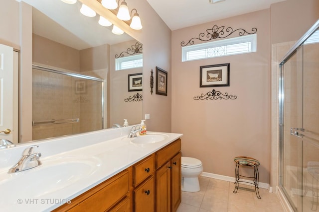 2026 Highbury Ln, Aurora, IL 60502 - full bathroom featuring double vanity, a stall shower, plenty of natural light, and tile patterned floors
