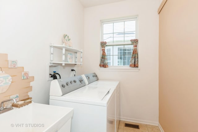 2026 Highbury Ln, Aurora, IL 60502 - laundry area featuring independent washer and dryer and light tile patterned floors