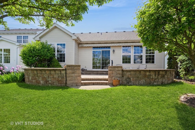 2026 Highbury Ln, Aurora, IL 60502 - rear view of house featuring a yard and a shingled roof