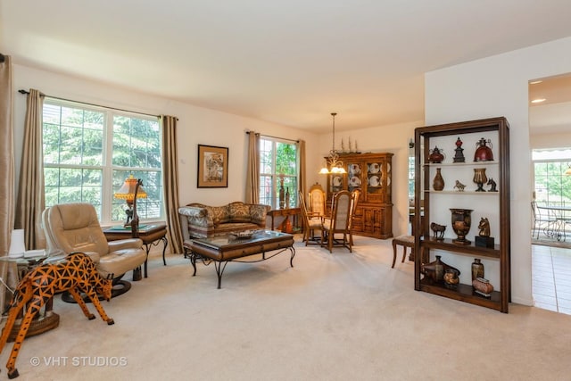 2026 Highbury Ln, Aurora, IL 60502 - living room with carpet and a chandelier