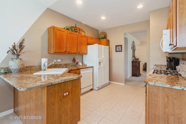 2026 Highbury Ln, Aurora, IL 60502 - kitchen with white appliances, a peninsula, brown cabinetry, recessed lighting, and light stone counters