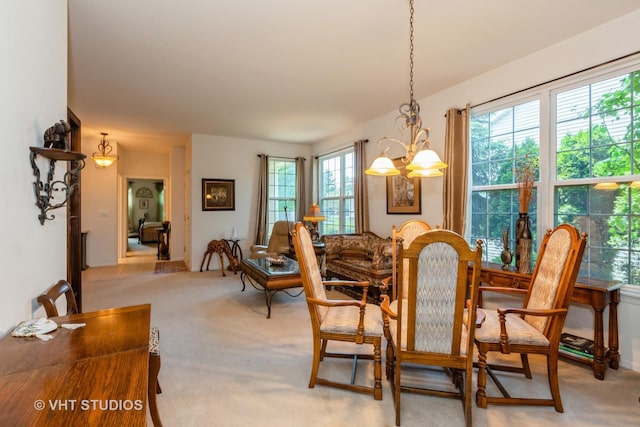 2026 Highbury Ln, Aurora, IL 60502 - dining room featuring light colored carpet and a chandelier