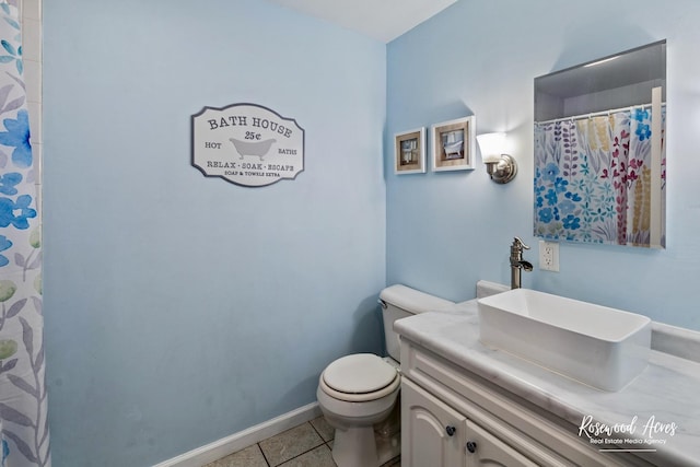 857 Edwin Dr, Bourbonnais, IL 60914 - bathroom featuring tile patterned floors, toilet, vanity, and baseboards