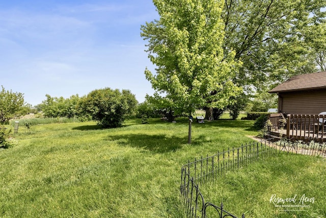 857 Edwin Dr, Bourbonnais, IL 60914 - view of grassy yard with a deck