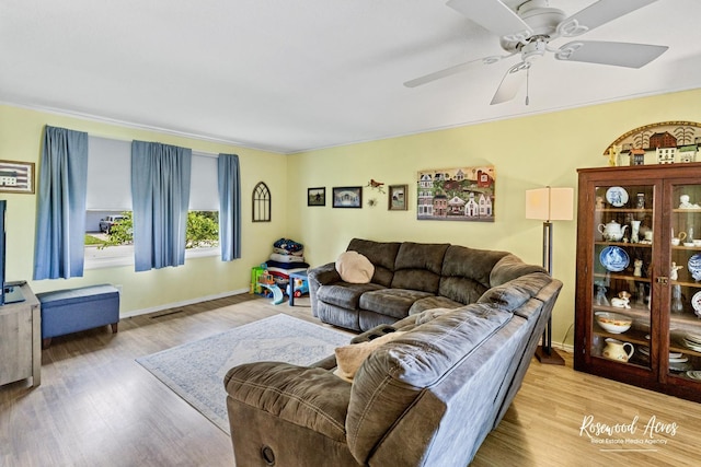 857 Edwin Dr, Bourbonnais, IL 60914 - living area with a ceiling fan, light wood-style flooring, and baseboards