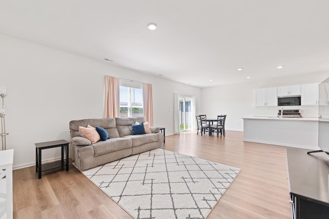 1391 Aspen Ln, Pingree Grove, IL 60140 - living room featuring light wood-style flooring, recessed lighting, and baseboards