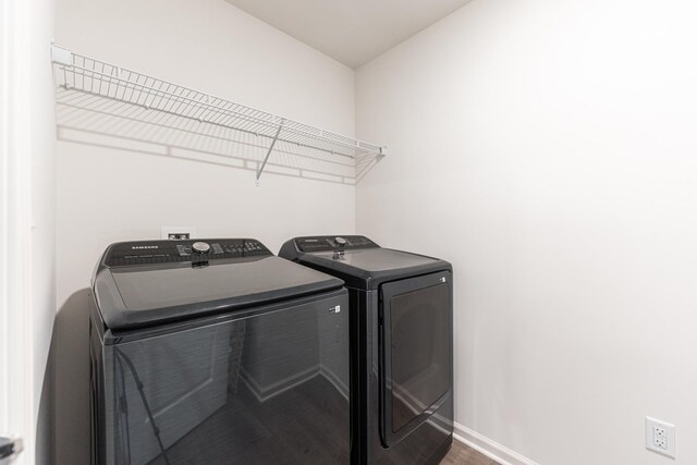 1391 Aspen Ln, Pingree Grove, IL 60140 - laundry area featuring washer and dryer and wood finished floors