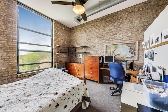 1800 W Roscoe St Unit 432, Chicago, IL 60657 - carpeted bedroom featuring brick wall, an office area, and a ceiling fan