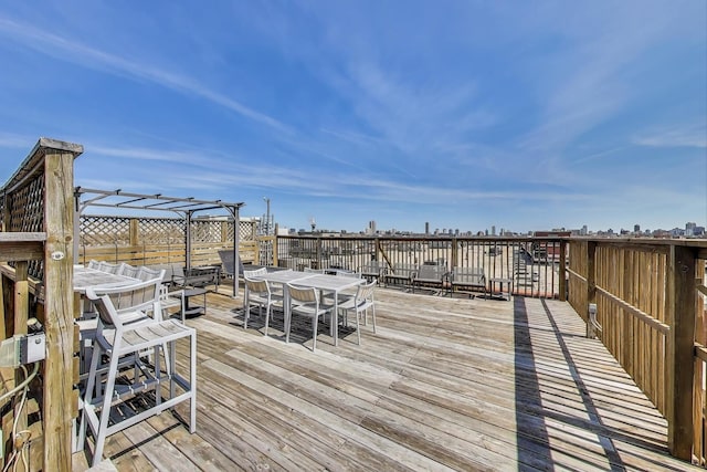 1800 W Roscoe St Unit 432, Chicago, IL 60657 - wooden deck with outdoor dining area