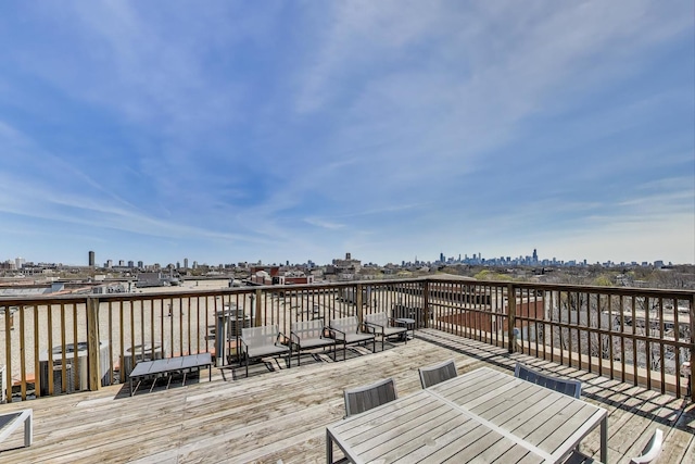 1800 W Roscoe St Unit 432, Chicago, IL 60657 - wooden terrace featuring outdoor dining area and a water view