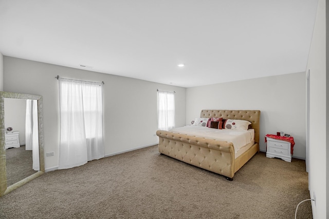 carpeted bedroom featuring recessed lighting