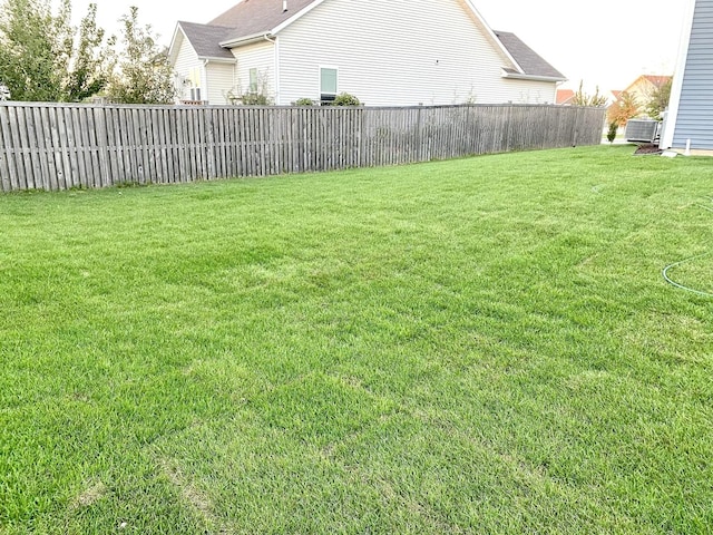 view of yard with central AC unit