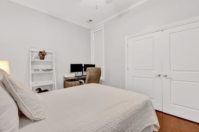 1359 W Fullerton Ave Unit 2E, Chicago, IL 60614 - bedroom with ornamental molding, wood finished floors, a ceiling fan, and a closet