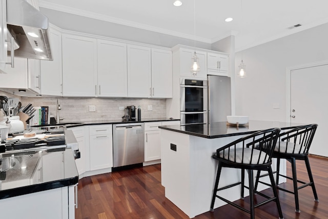 1359 W Fullerton Ave Unit 2E, Chicago, IL 60614 - kitchen featuring appliances with stainless steel finishes, extractor fan, ornamental molding, dark wood finished floors, and white cabinetry
