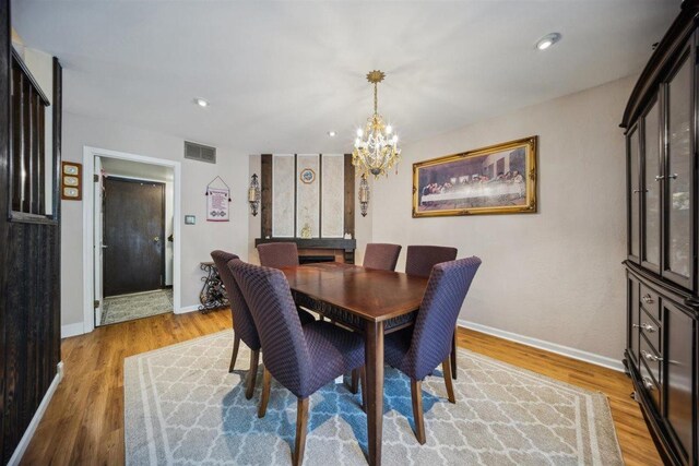 2121 Pepperwood Ln Unit 0, Glendale Heights, IL 60139 - dining room with light wood-style flooring, a chandelier, baseboards, and recessed lighting