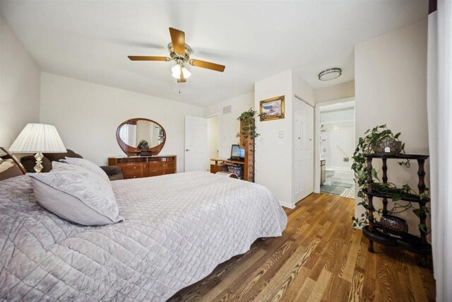 2121 Pepperwood Ln Unit 0, Glendale Heights, IL 60139 - bedroom featuring wood finished floors, ceiling fan, baseboards, and connected bathroom