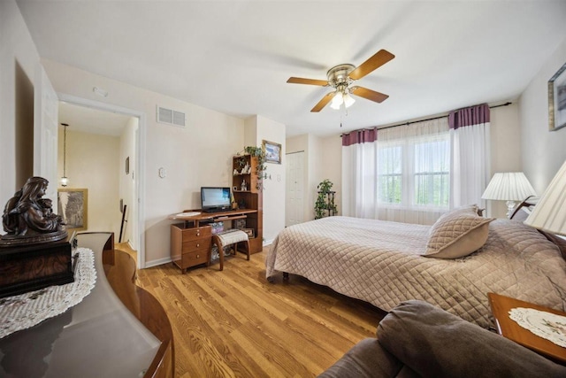 2121 Pepperwood Ln Unit 0, Glendale Heights, IL 60139 - bedroom featuring light wood finished floors, a ceiling fan, baseboards, and a closet