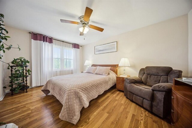 2121 Pepperwood Ln Unit 0, Glendale Heights, IL 60139 - bedroom featuring light wood finished floors and a ceiling fan