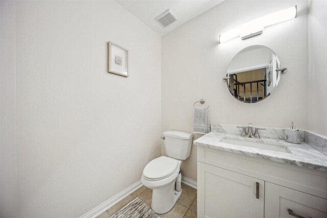 2121 Pepperwood Ln Unit 0, Glendale Heights, IL 60139 - half bath with baseboards, vanity, toilet, and tile patterned flooring
