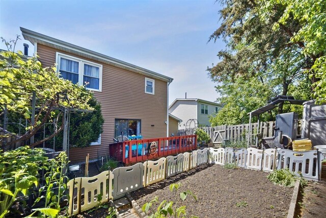 2121 Pepperwood Ln Unit 0, Glendale Heights, IL 60139 - back of house with a deck and a fenced backyard